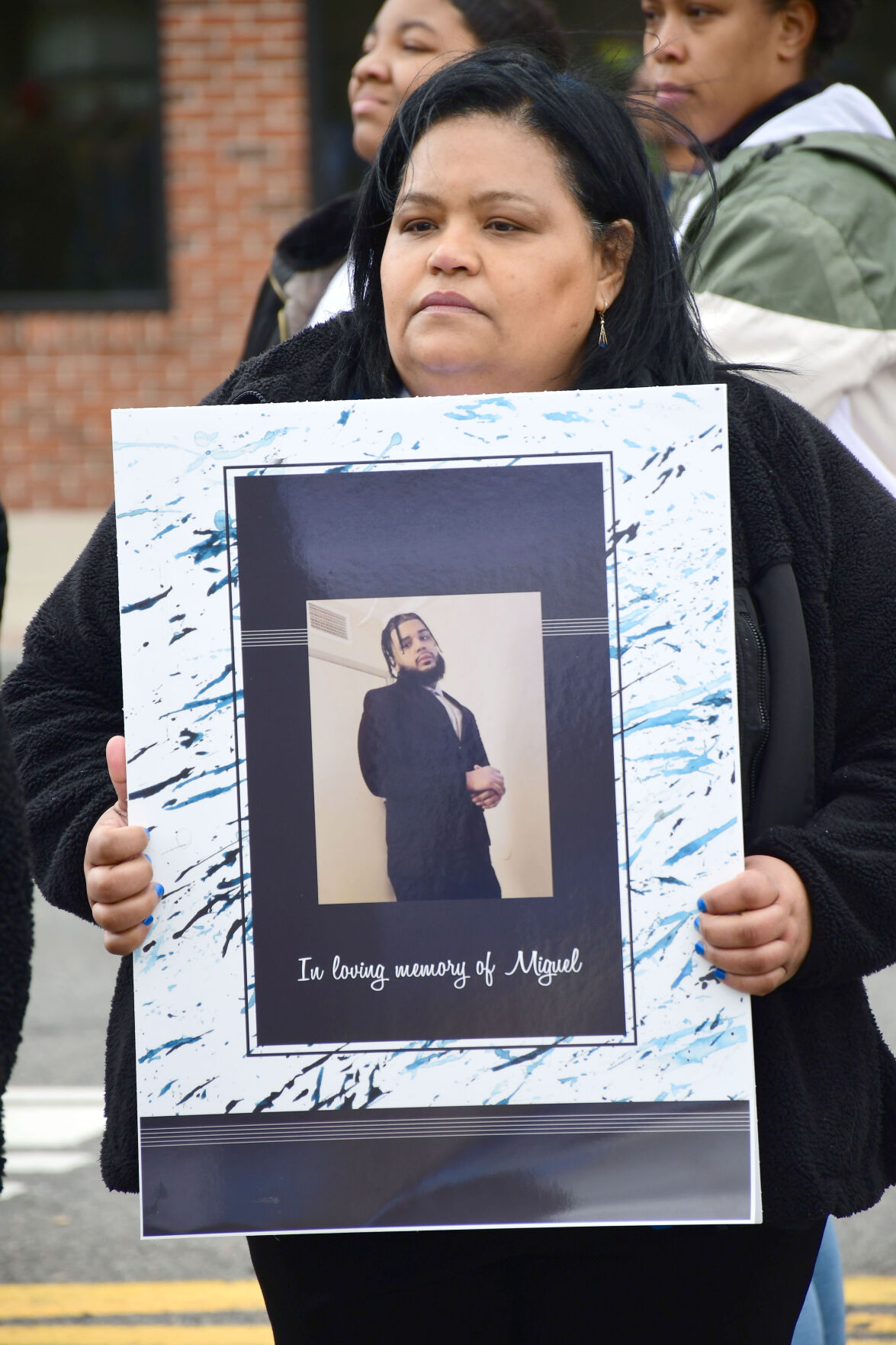 Marisol Estrella holds a photo of her late son (copy)